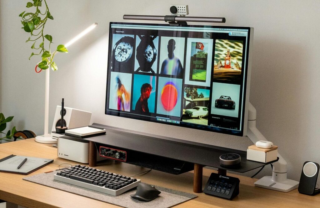 Stylish home office desk featuring a modern computer setup and clean aesthetic.